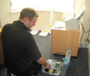 A Fred Weston engineer carrying out portable appliance testing